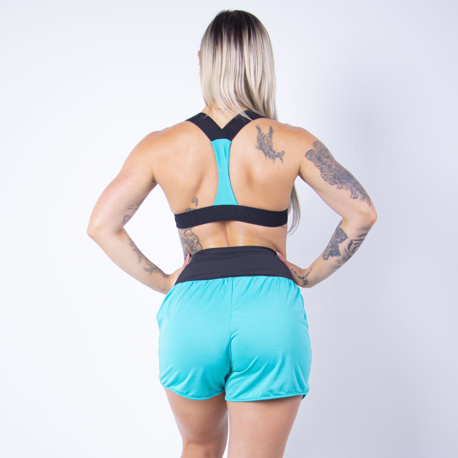 Conjunto Fitness em Dry Fit Verde com Top e Shortinho com Bolsos