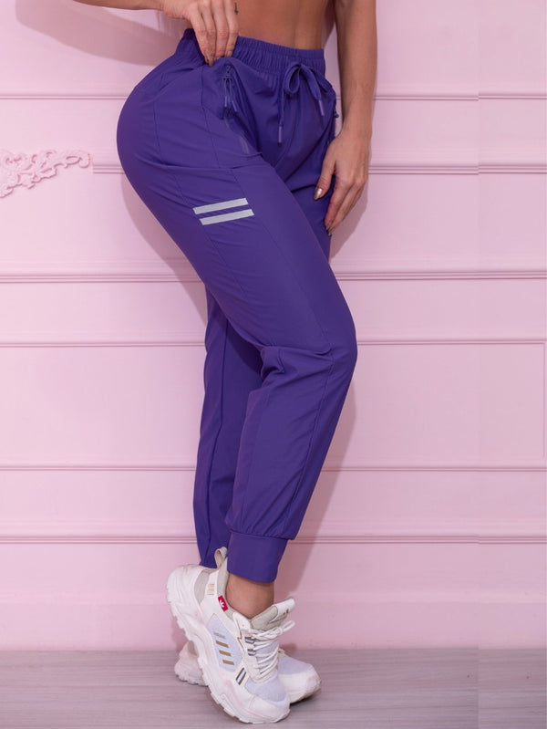 Calça Jogger Fitness Roxo com Detalhe Refletivo